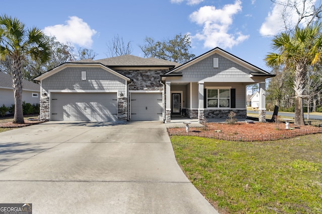 craftsman inspired home with a garage, stone siding, and concrete driveway