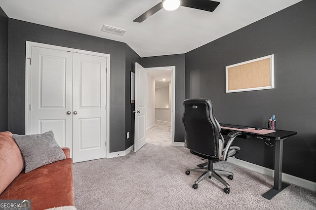 office space with carpet, visible vents, ceiling fan, and baseboards