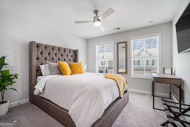 bedroom featuring a ceiling fan, carpet, visible vents, and baseboards