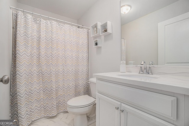 full bathroom with marble finish floor, a shower with shower curtain, vanity, and toilet