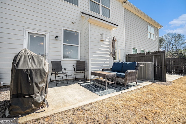 view of patio with fence, an outdoor hangout area, and central air condition unit