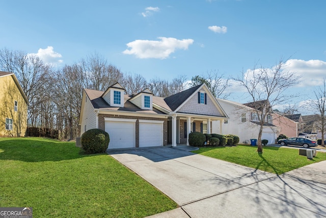 view of front of house featuring a garage, driveway, a front lawn, and brick siding