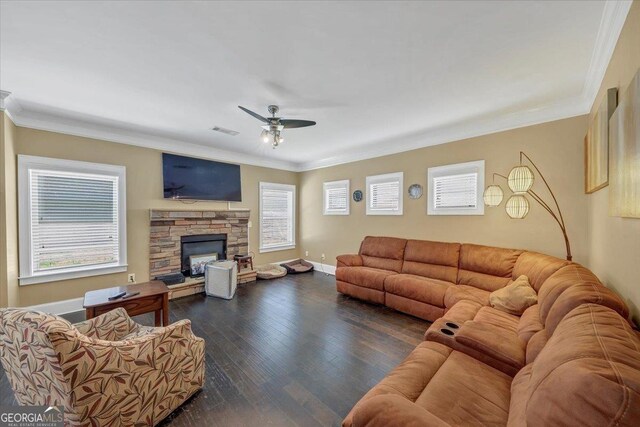 living area featuring hardwood / wood-style floors, ornamental molding, plenty of natural light, and visible vents