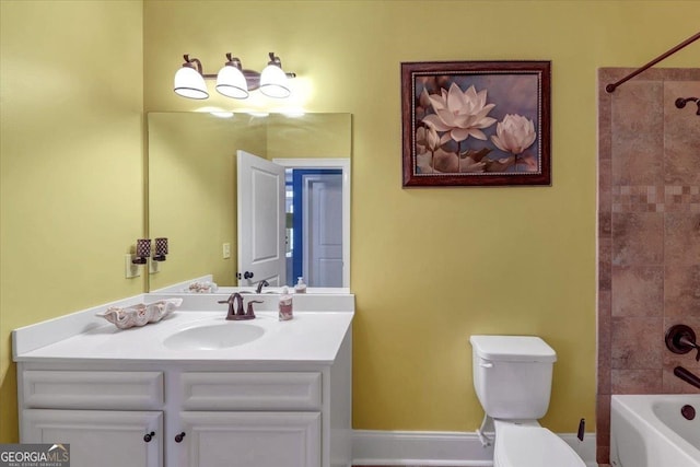 full bathroom featuring toilet, washtub / shower combination, baseboards, and vanity