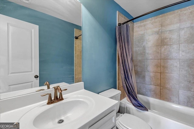 bathroom with vanity, shower / bath combination with curtain, and toilet