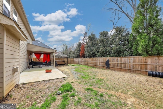 view of yard featuring a patio area and a fenced backyard