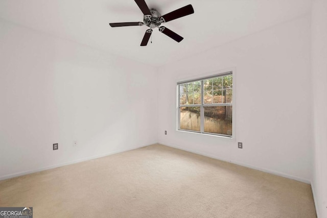 unfurnished room with light colored carpet