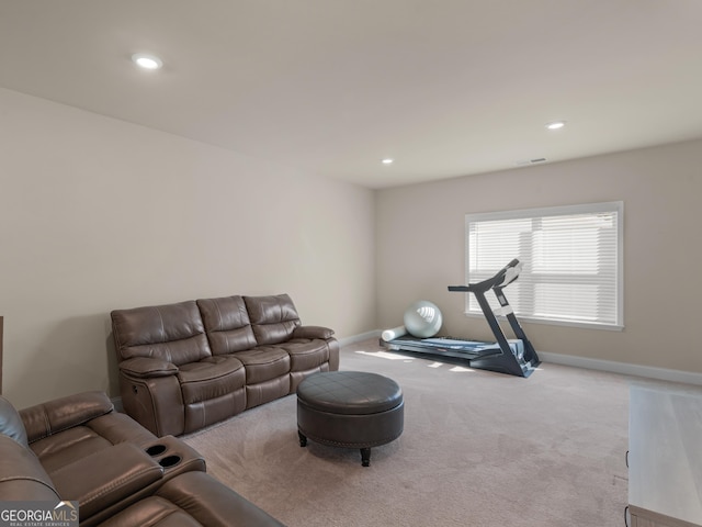 living room with carpet floors, recessed lighting, visible vents, and baseboards