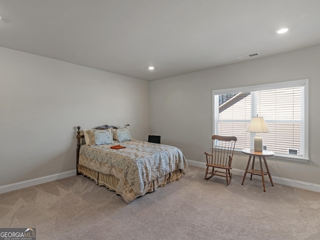 bedroom featuring light colored carpet, visible vents, baseboards, and recessed lighting