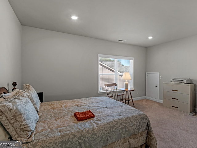 bedroom featuring baseboards, recessed lighting, visible vents, and light colored carpet