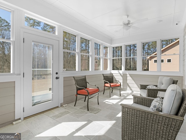 sunroom / solarium with ceiling fan