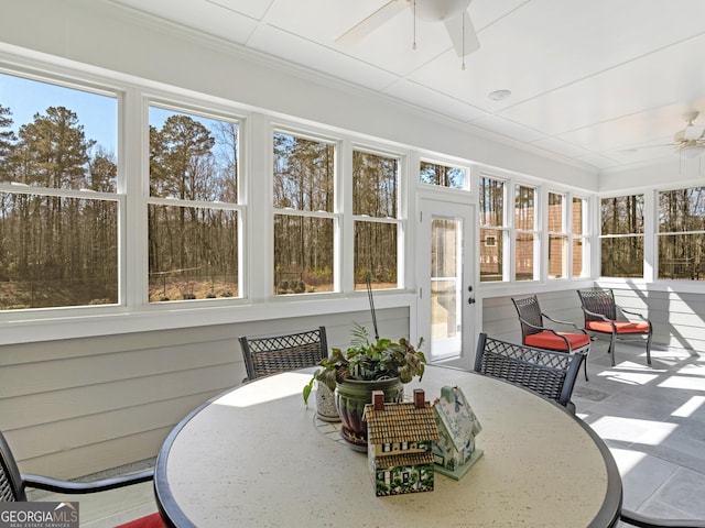 sunroom / solarium with ceiling fan