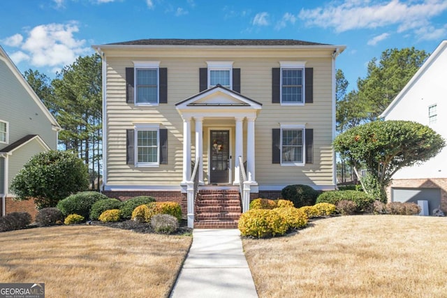 view of front of home featuring a front yard