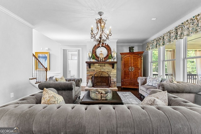 living room featuring baseboards, ornamental molding, dark wood-type flooring, an inviting chandelier, and a fireplace