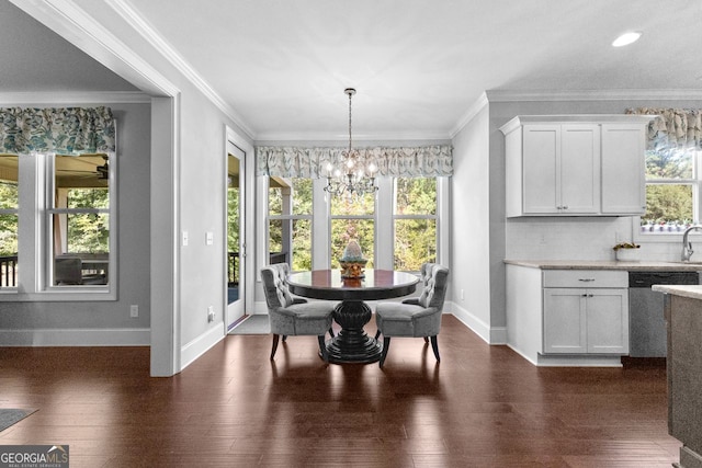 dining area with dark wood-style flooring, a healthy amount of sunlight, and a notable chandelier