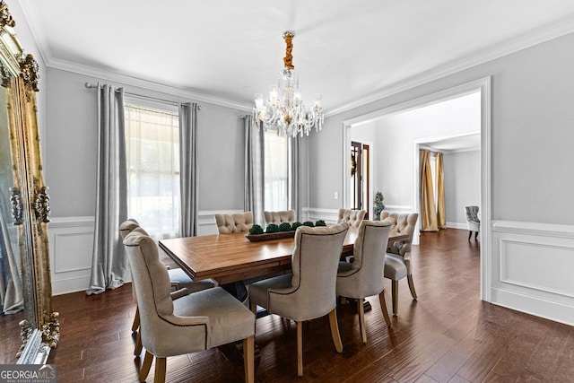 dining room featuring an inviting chandelier, dark wood finished floors, and crown molding