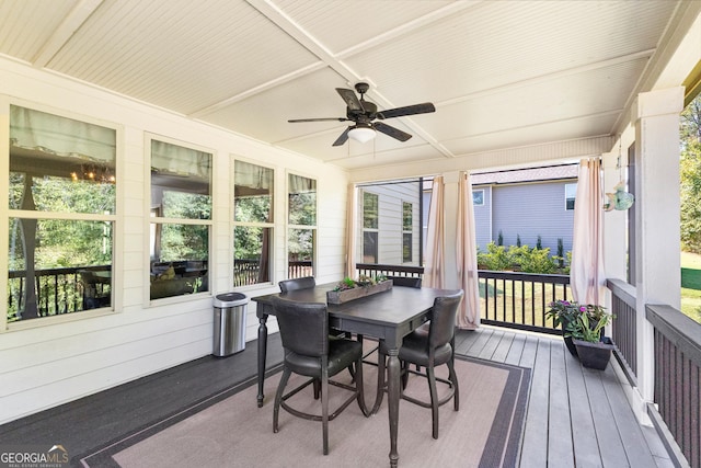 sunroom / solarium with a healthy amount of sunlight and ceiling fan