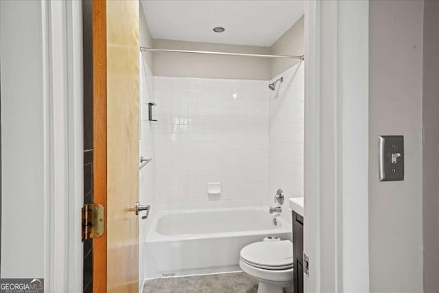 bathroom featuring shower / washtub combination, vanity, and toilet