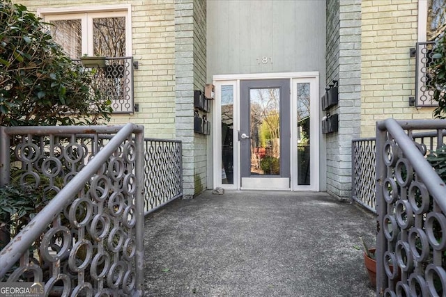 property entrance with brick siding