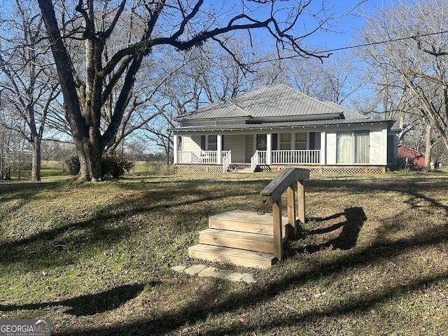 view of front of house with metal roof and a porch