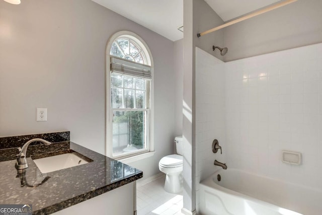full bathroom with toilet, baseboards, shower / washtub combination, and vanity