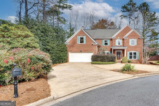 view of front facade with concrete driveway, brick siding, and an attached garage