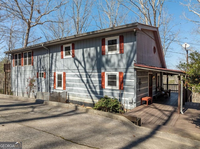 exterior space featuring a wooden deck