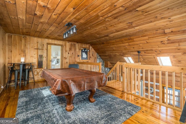 recreation room featuring wood walls, wood ceiling, lofted ceiling, and hardwood / wood-style flooring