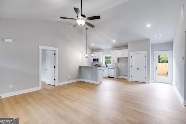 unfurnished living room featuring a ceiling fan, baseboards, visible vents, and light wood finished floors