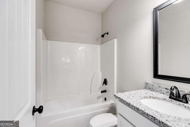 bathroom with vanity, toilet, and shower / bathtub combination