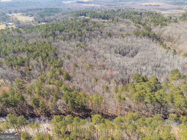 drone / aerial view with a view of trees