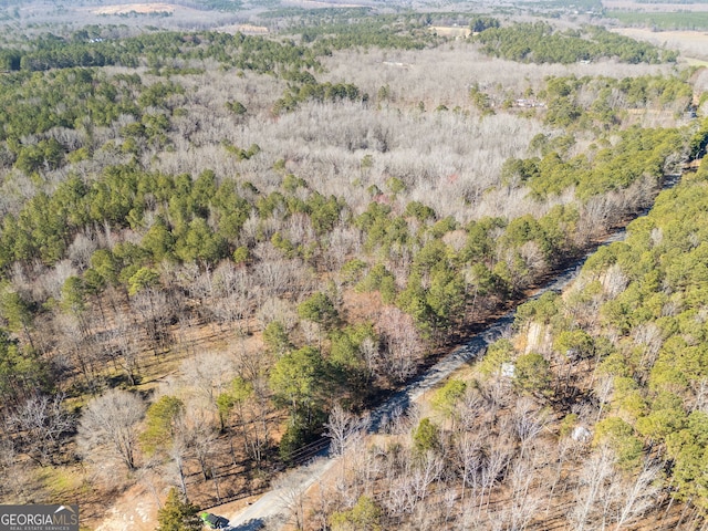 aerial view featuring a wooded view