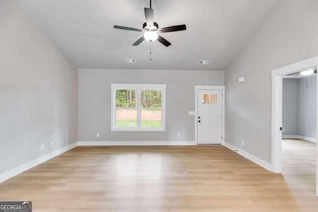 interior space with visible vents, light wood finished floors, a ceiling fan, and baseboards