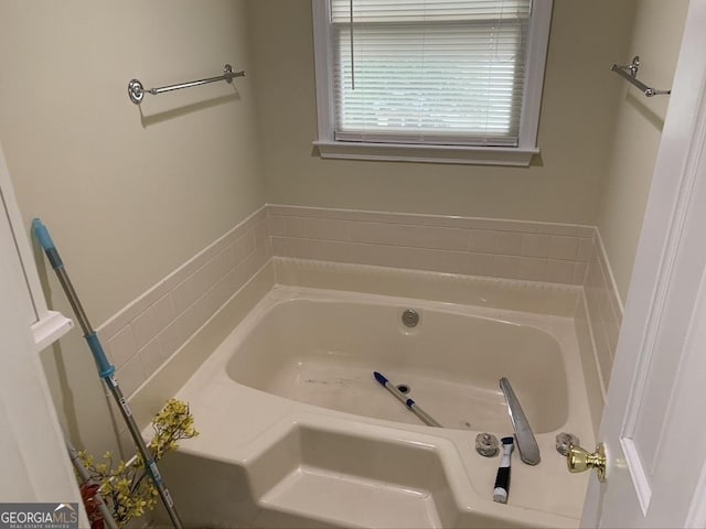 bathroom with a garden tub