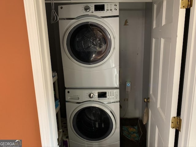 laundry room with stacked washer and dryer