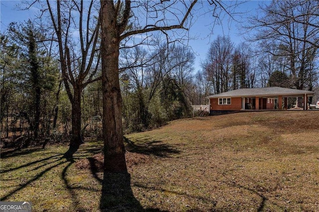 view of yard featuring covered porch