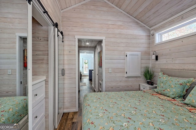 unfurnished bedroom featuring a barn door, vaulted ceiling, wood walls, wood finished floors, and wooden ceiling