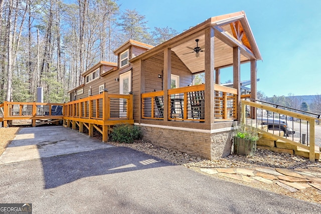 view of property exterior with a wooden deck