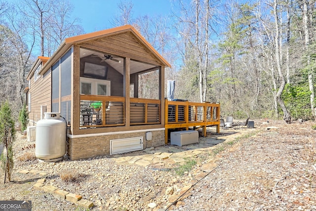 exterior space featuring a sunroom