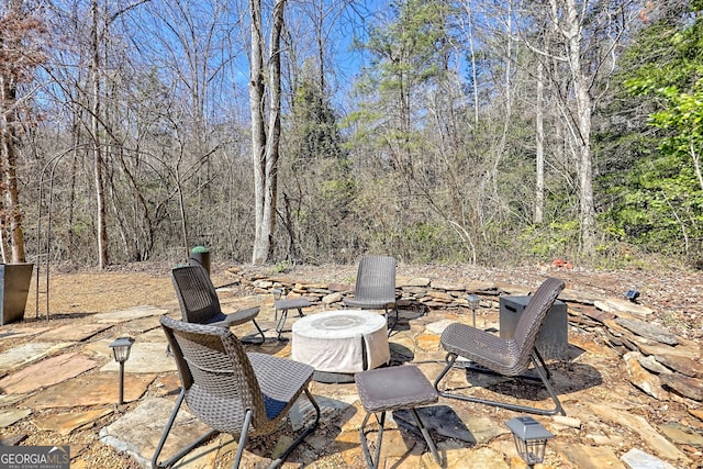 view of patio featuring a wooded view