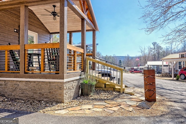 view of side of property featuring stairs