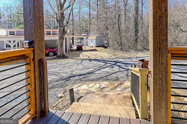 exterior space featuring an outbuilding and a storage shed