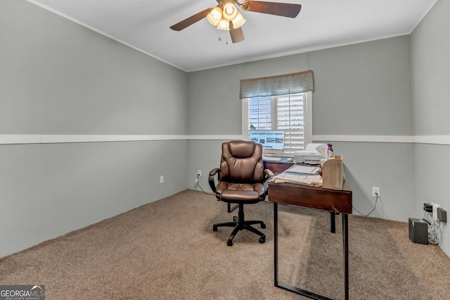 office area featuring ceiling fan, ornamental molding, and carpet