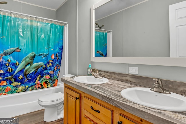 full bath featuring double vanity, shower / bath combination with curtain, wood finished floors, and a sink