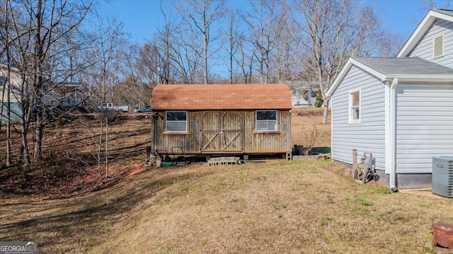 view of shed with central air condition unit