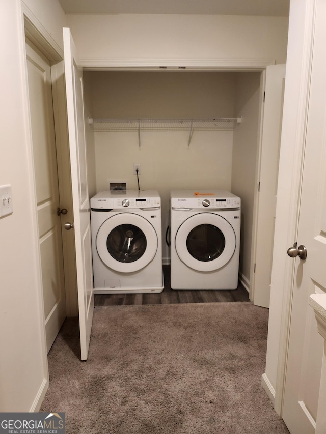 laundry room with carpet floors, laundry area, washing machine and dryer, and baseboards