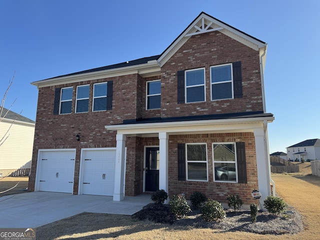 view of front facade featuring a garage, brick siding, and driveway