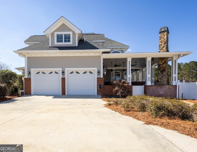 view of front of home featuring a garage, brick siding, and driveway