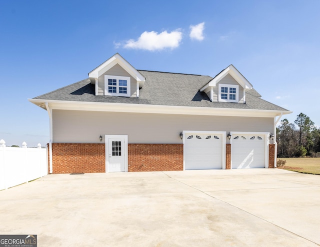 exterior space with driveway and fence