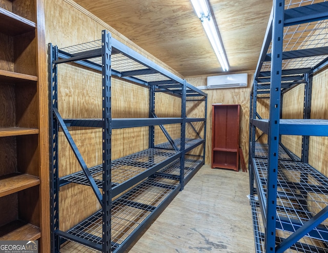 unfurnished bedroom featuring a wall unit AC